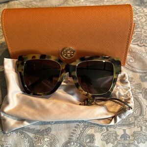 Brand new with tags and original case. Tory Burch tortoise and gold sunglasses.